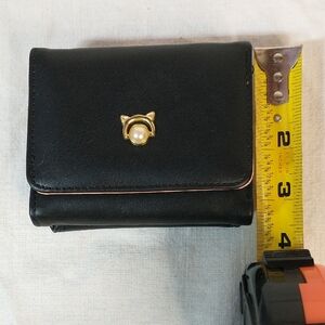 Black Wallet with Gold & Pearl Cat Emblem.